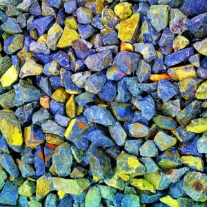 Vibrant blue and yellow gravel stones creating a textured pattern in Bhagalpur, India.